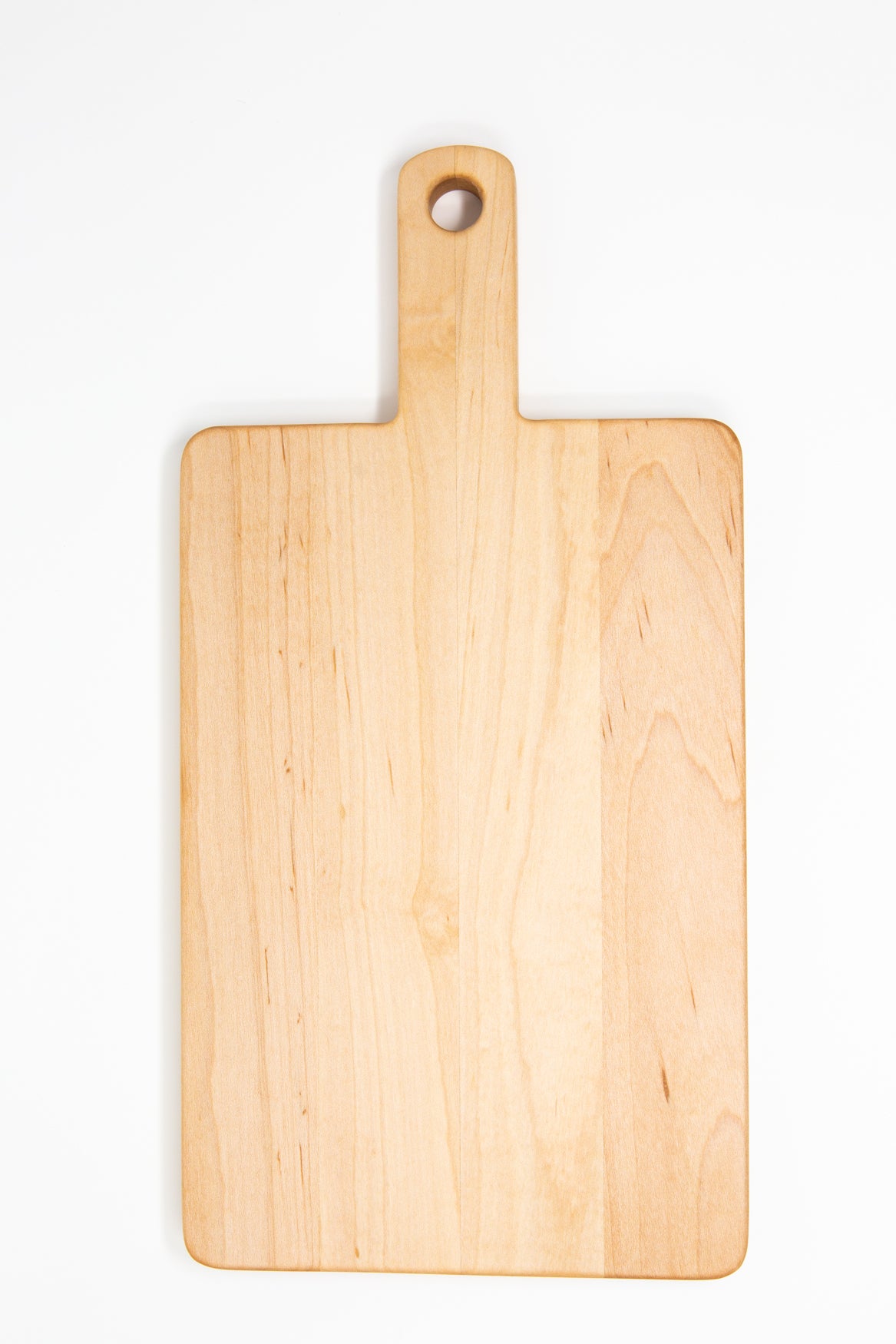 Small wood charcuterie board, made of light blonde Maple, with a timeless rectangular shape and a straight handle.